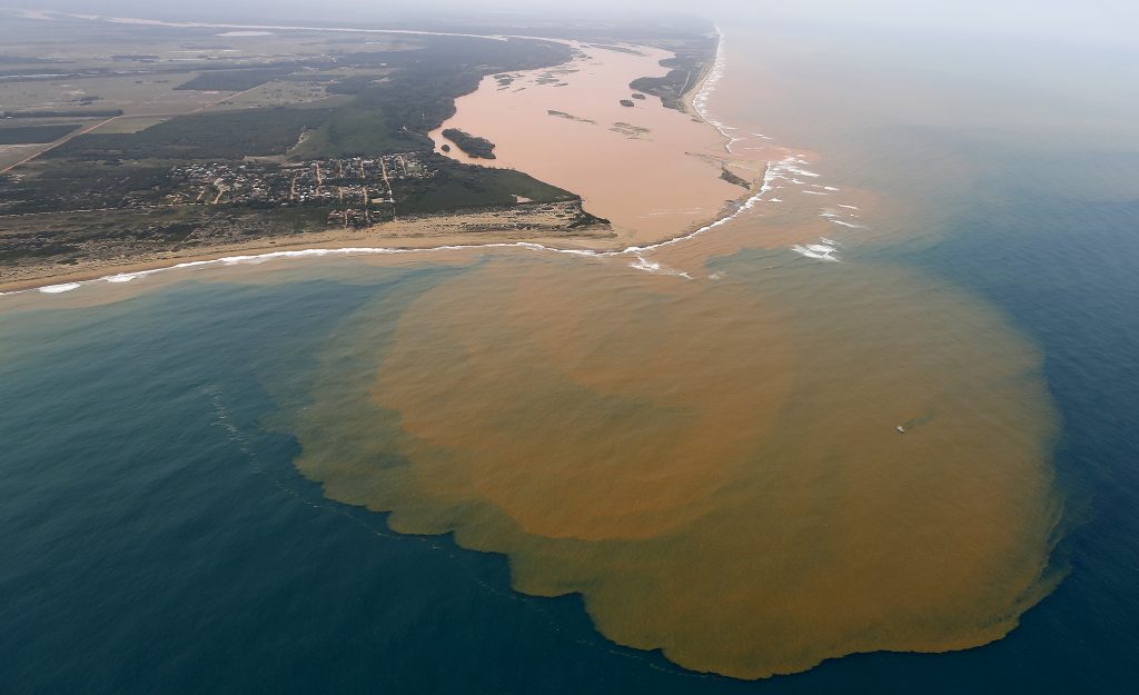 An aerial view of the Rio Doce, which was flooded with mud after a dam owned by Vale SA and BHP Billiton Ltd burst, at an area where the river joins the sea on the coast of Espirito Santo in Regencia Village